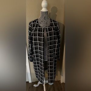 Women’s black, cream and gray suit jacket.